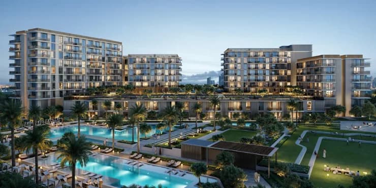 Infinity pools and landscaped courtyards between residences at Rashid Yachts & Marina at dusk