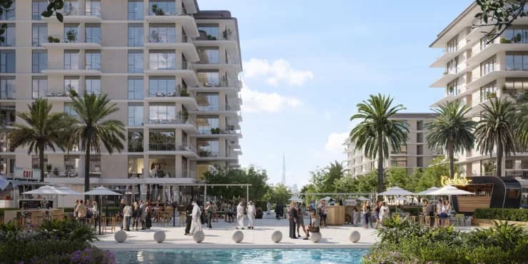 Pedestrian promenade with cafés between waterfront buildings at Rashid Yachts & Marina