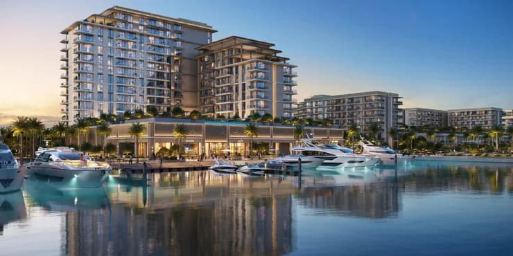Rashid Yachts & Marina waterfront towers at dusk with yachts moored along the promenade